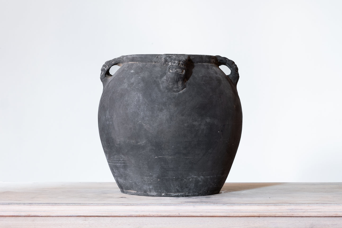 BLACK CERAMIC LION'S HEAD POT, C.1910