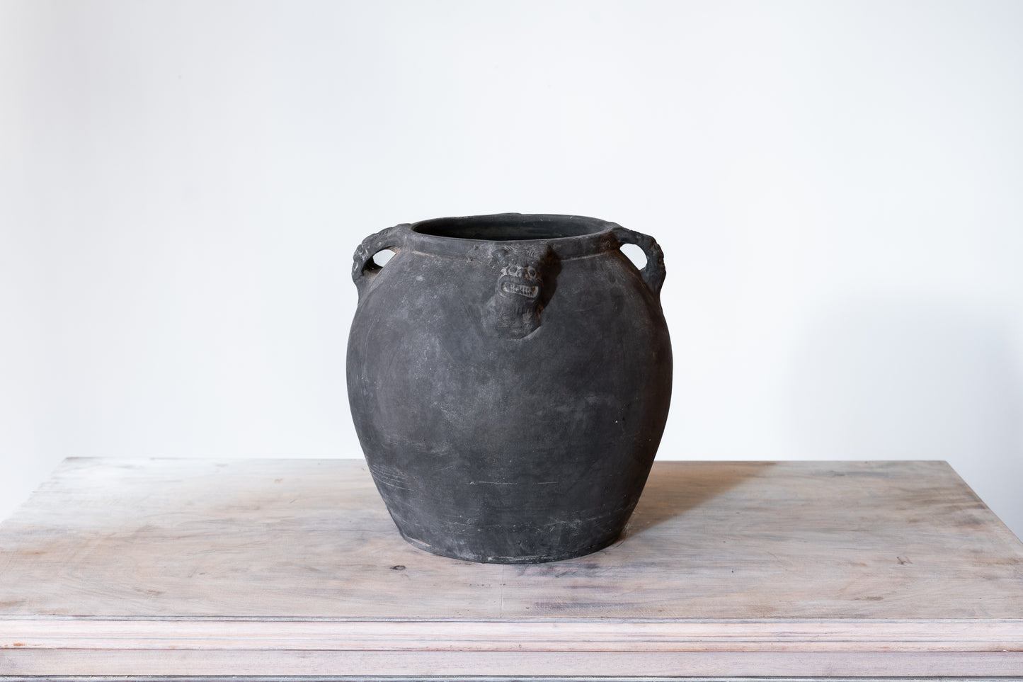 BLACK CERAMIC LION'S HEAD POT, C.1910