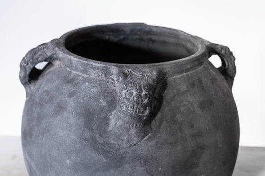 BLACK CERAMIC LION'S HEAD POT, C.1910